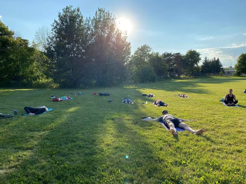 People doing yoga outdoors